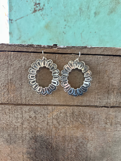 Closer up picture of hanging Believer Silver Concho Earrings.