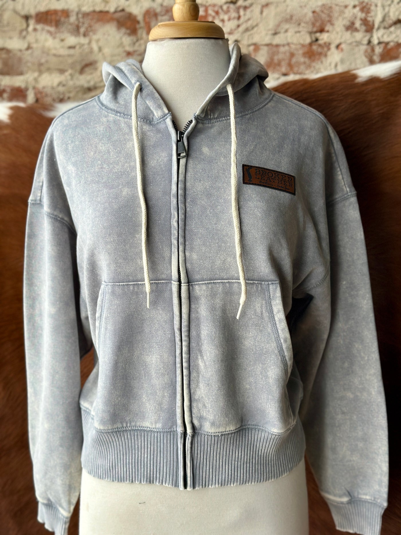 Western-inspired neutral zip-up hoodie with soft, lived-in feel.