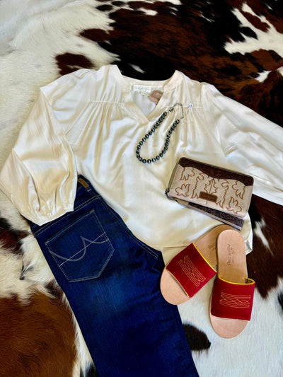 Flatlay outfit inspiration featuring our Alexandra Balloon Sleeve Blouse.