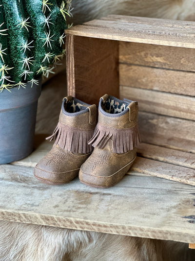 Toddler cowgirl boots with rubber outsole for first steps.