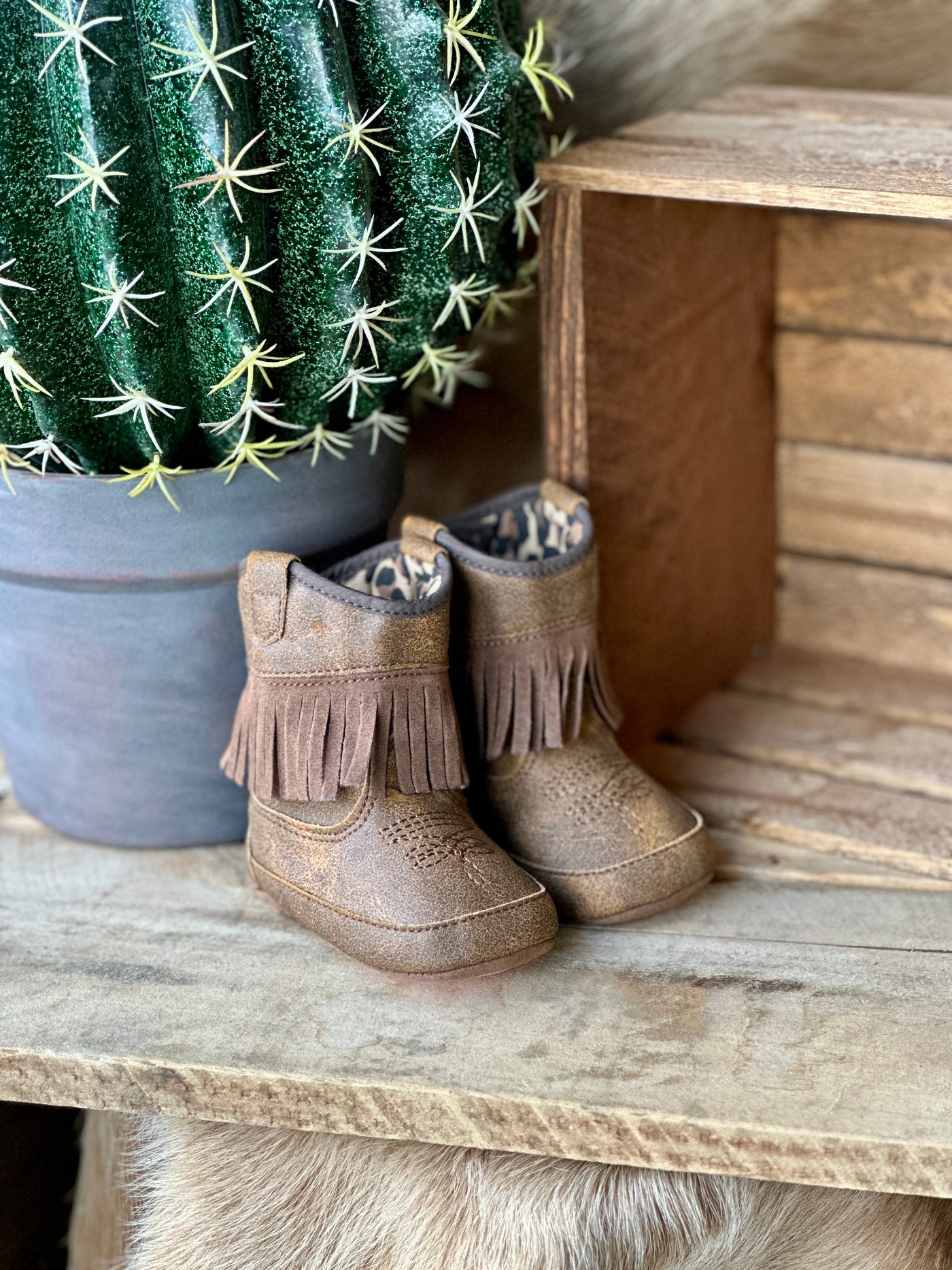 Comfortable and durable baby cowgirl boots for early walkers.