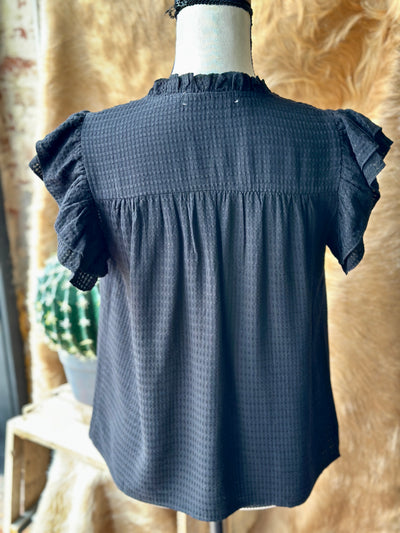 Elegant black blouse for work, date night, or everyday wear.