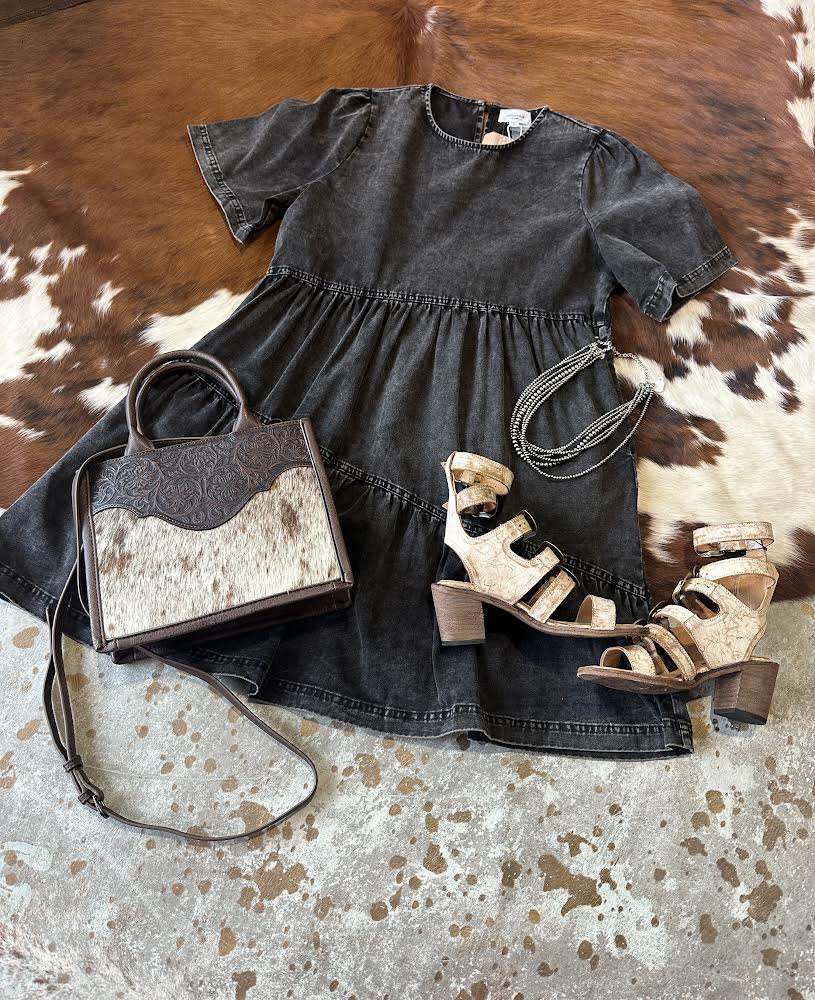 Mineral washed denim dress with a relaxed fit and 100% cotton material styled with with Leather Heels and a cowhide crossbody.