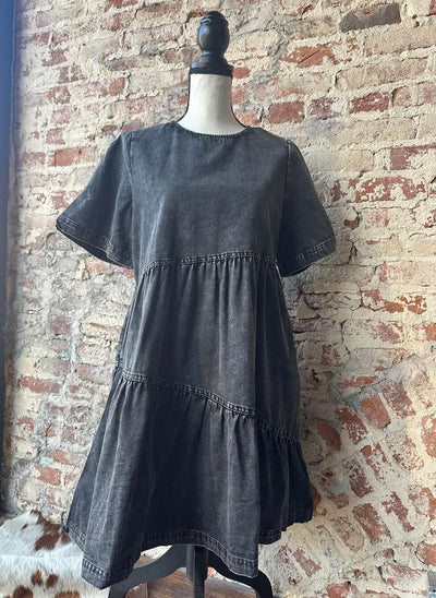 Annette Denim Dress showcasing its soft texture and casual short sleeved elegance.