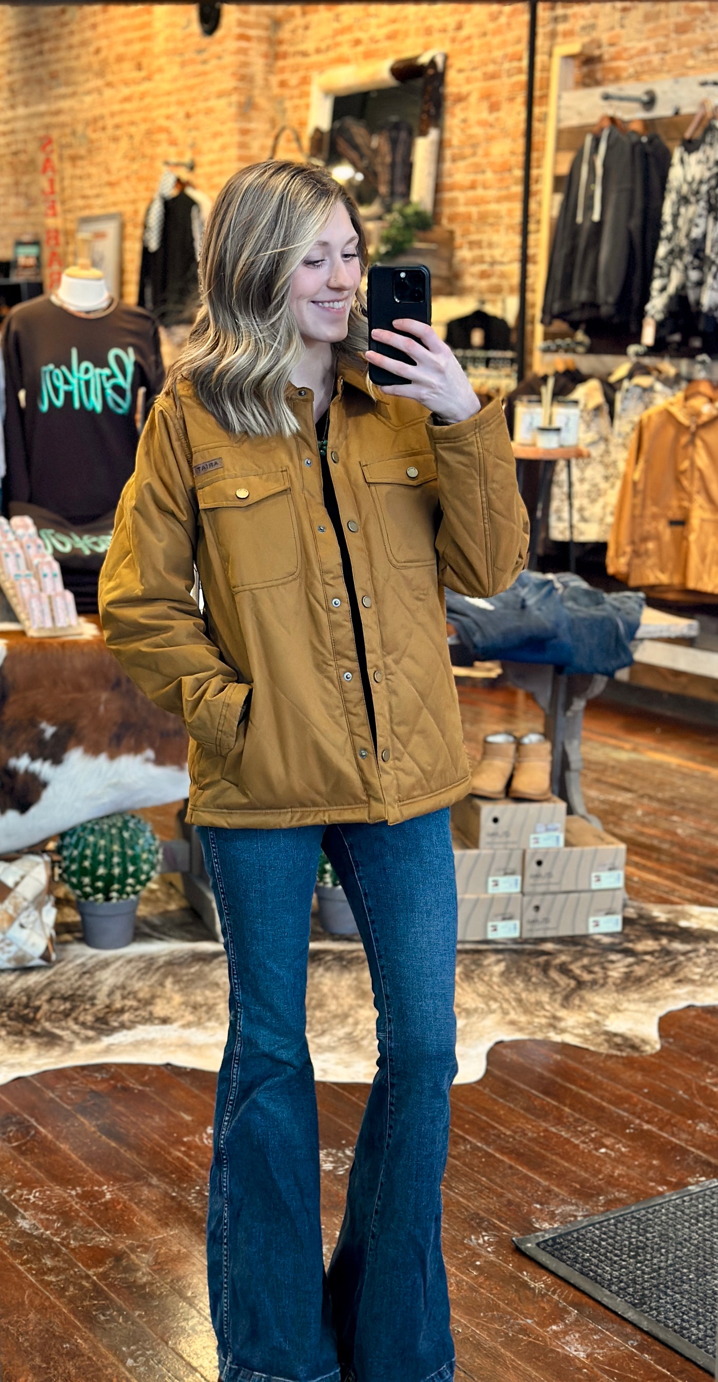 Crafted in a classic chestnut hue reminiscent of Carhartt's iconic brown, this jacket, modeled by a Broker Leather employee, effortlessly blends rugged durability with stylish flair.