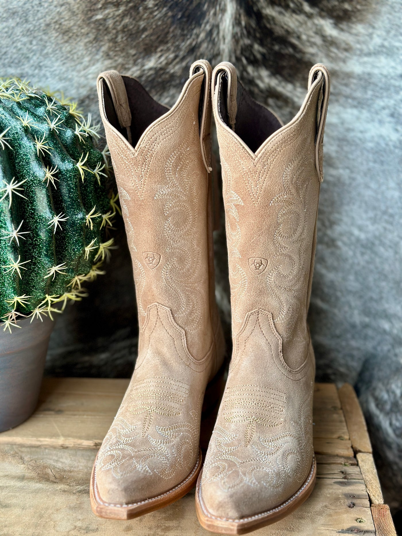 Timeless western snip toe boots with genuine leather, a subtle dress heel, and intricate stitching.