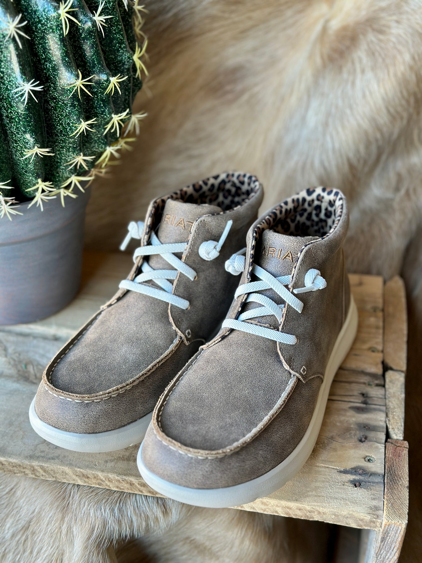 Ariat Hilo high-top moc toe slip-on shoes with cushioned insole and breathable comfort.