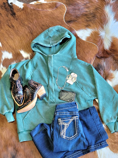 A flatlay outfit picture featuring our Puddles Mineral Wash Sweatshirt [Green] and Believer Earrings.