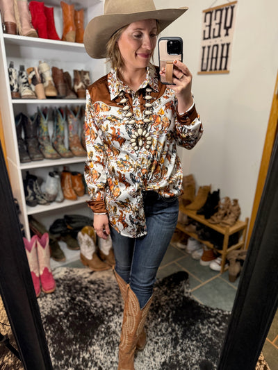 Model wearing Ariat Ella jeans tucked into cowgirl boots for a rodeo-ready look