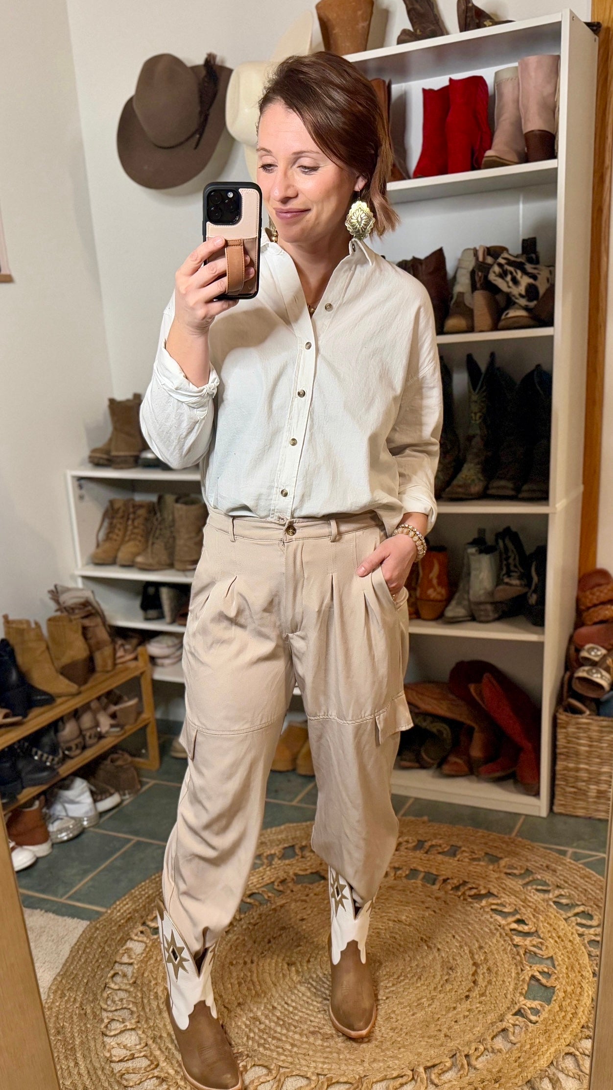 Model wearing the Ariat Starlight Snip Toe Boot with a classic white button down and dress pants, stepping into the spotlight with a bold Corporate Cowgirl look.