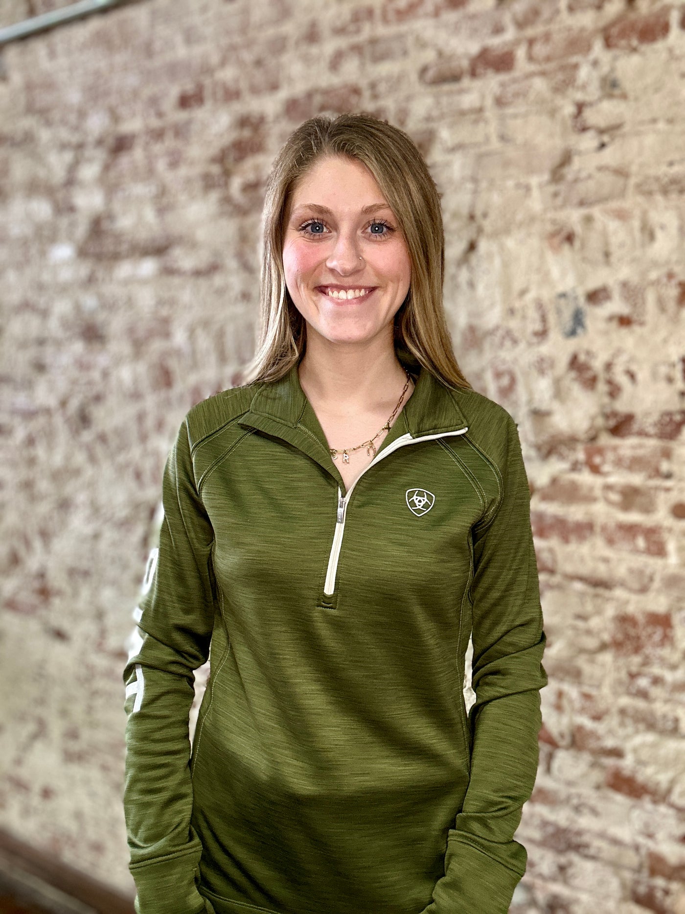 Ariat Tek Team 1/2 Zip Sweatshirt in deep green, ideal for layering during fall transitions.