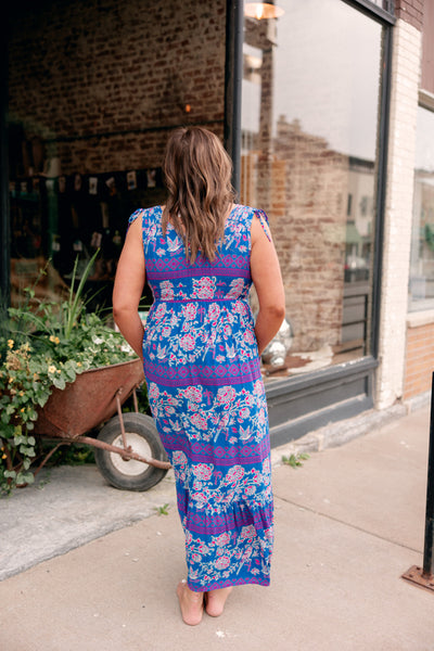 Back view of the pink and blue Ariat Westley Candelia Print Dress showing the flattering cinched waist and shoulder tie detail.