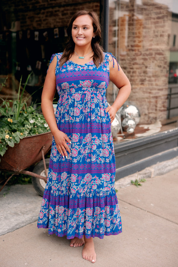 The Ariat Westley Candelia Print Dress paired with turquoise, adding a refined Western look to any outing.