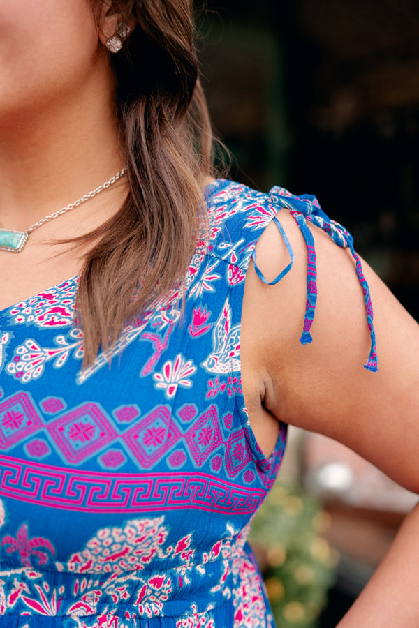 Close-up view of Ariat Westley Candelia Print Dress showcasing the intricate pattern details in pink and blue.