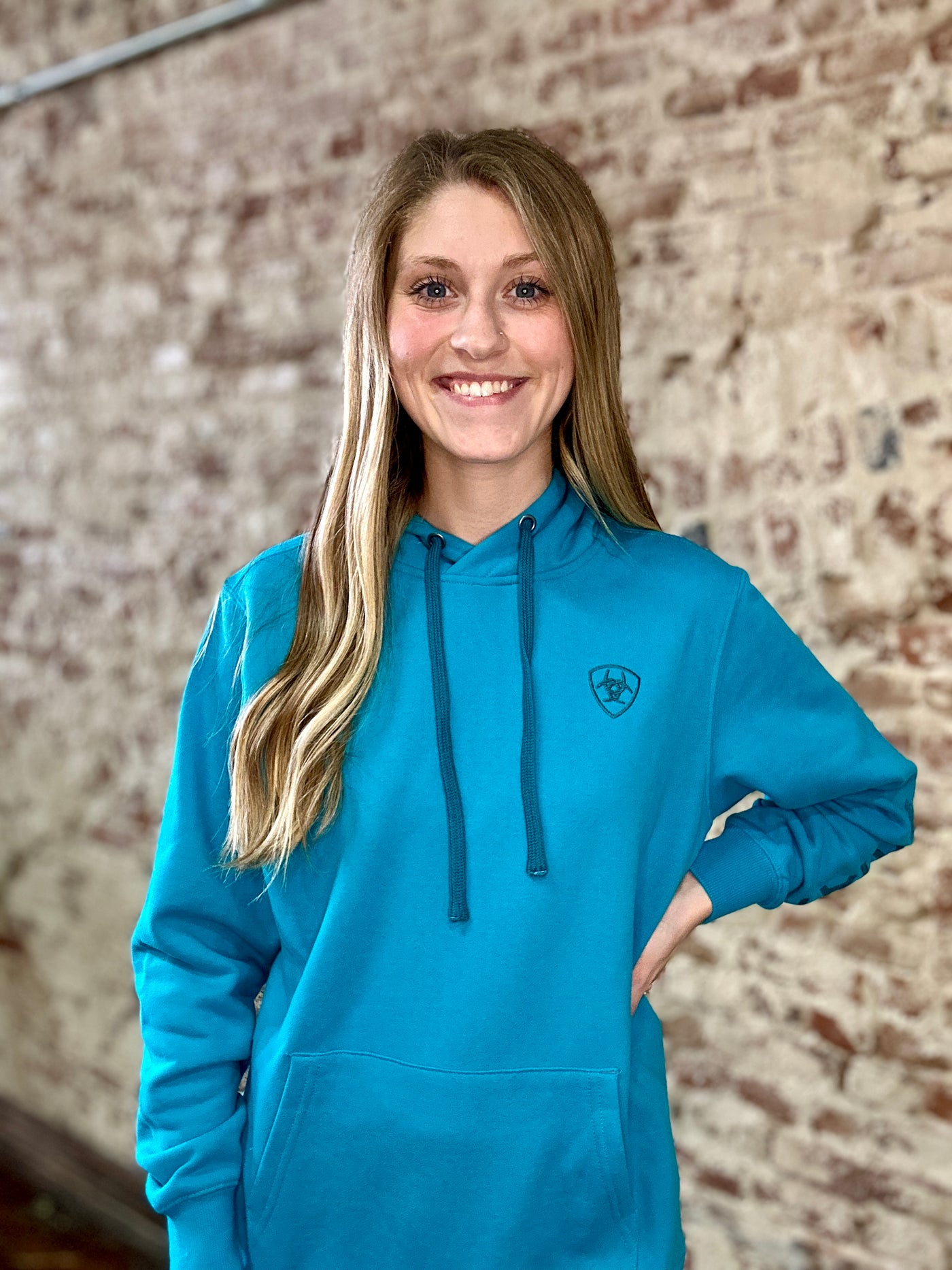 Woman modeling our Ariat Logo 2.0 Hoodie [Capri Breeze].