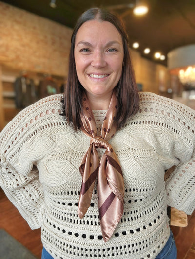 Woman modeling the Bayzlee Brown Polka Dot Wild Rag.