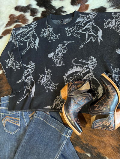 Feel stylishly put together with the Brad Rodeo Metallic Sweater, boots, and Ariat jeans.