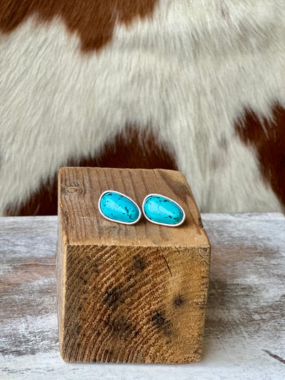 Brandon Turquoise Stud Earrings – handcrafted-look faux turquoise nuggets with antique silver trim.