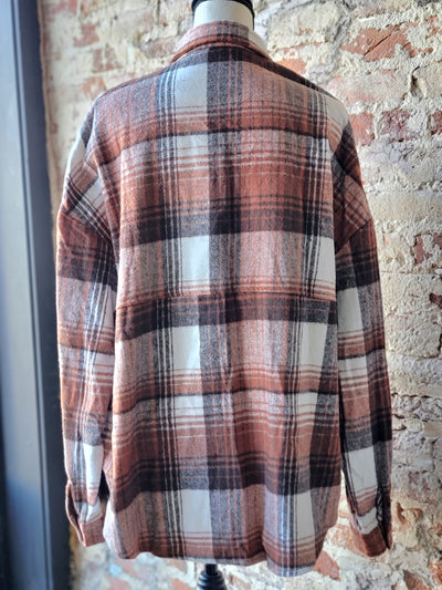 Broker Leather's Brandy Brown & Rust Plaid Shacket adds a touch of contemporary flair to any casual outfit.