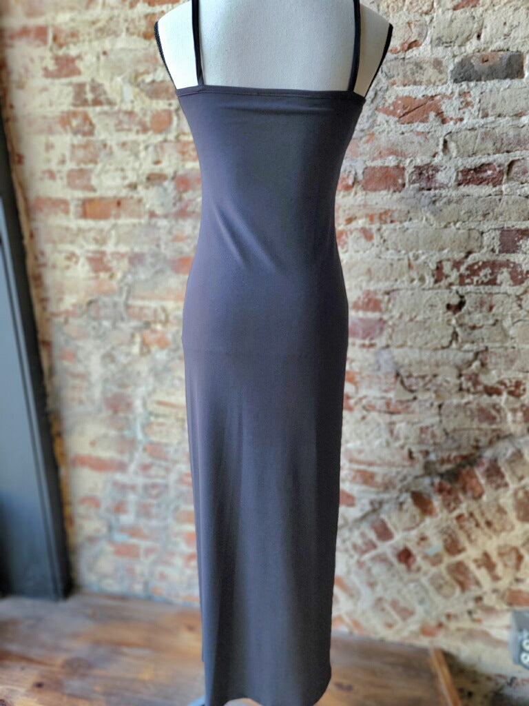 Versatile black maxi dress with spaghetti straps, transitioning effortlessly from day to night, perfect for any casual gathering.