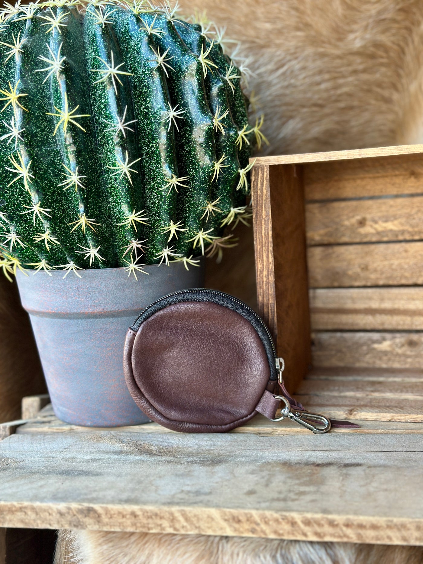 Western cowgirl coin purse with hand-tooled leather, zip closure, and durable lined interior.