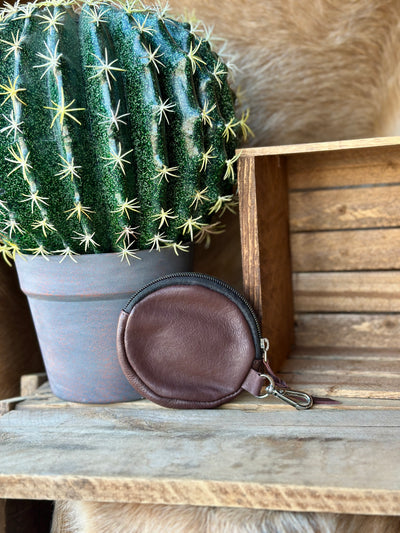 Western cowgirl coin purse with hand-tooled leather, zip closure, and durable lined interior.