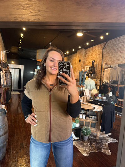 A woman modeling our Brenley Brown Quilted Vest.