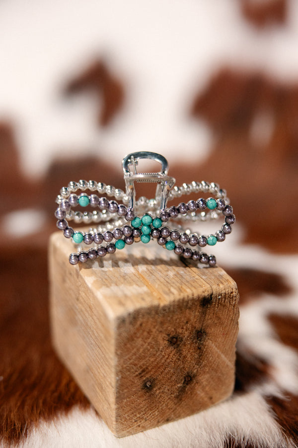 Full view of Brenna Turquoise Bow Hair Claw Clip, designed to add elegance and Western flair to your look.