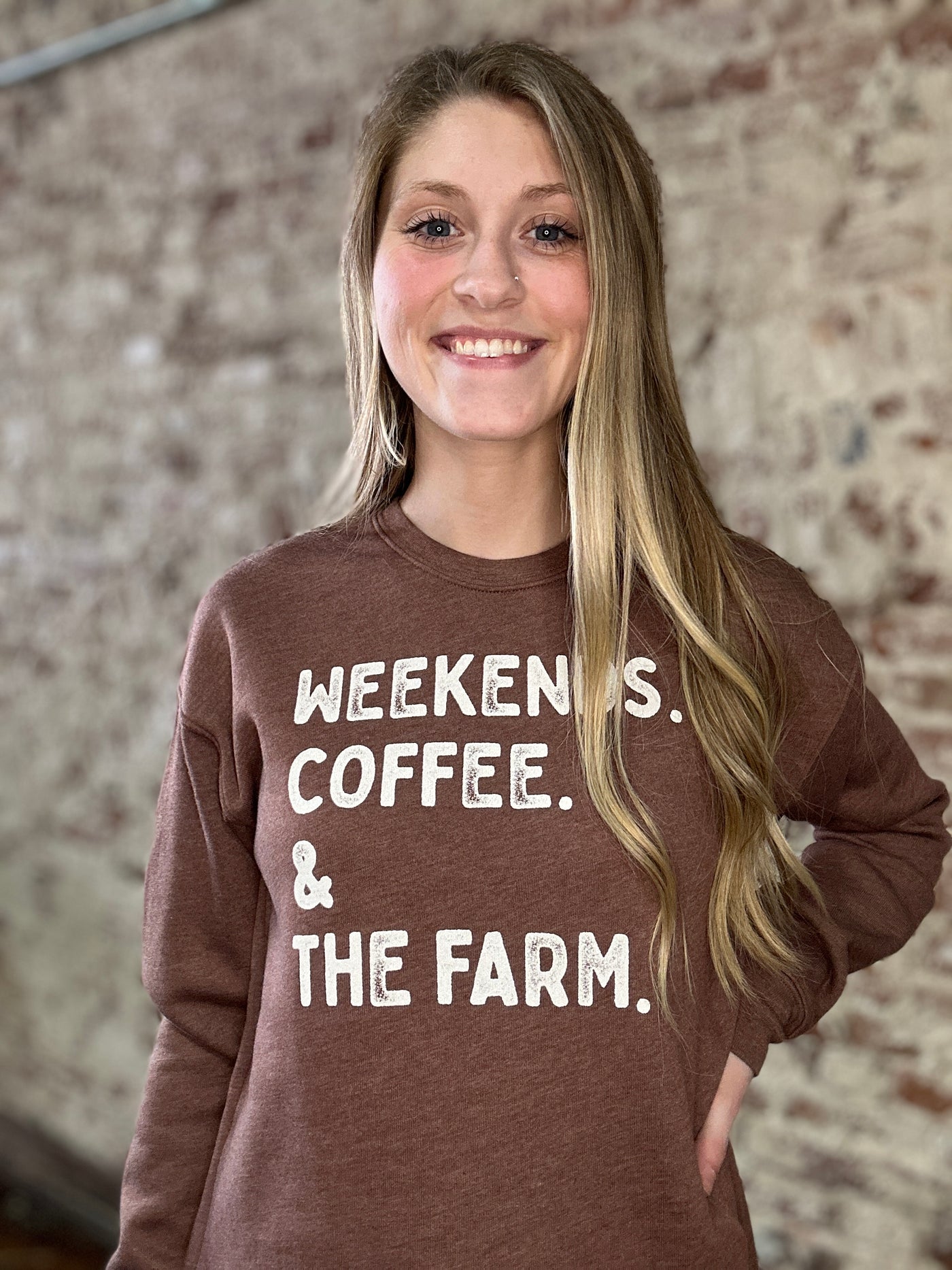 Chocolate brown crewneck sweatshirt with “Weekends, Coffee & Farm” graphic.