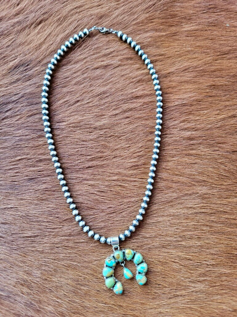 Timeless Western Turquoise Pendant with Classic Naja Silhouette