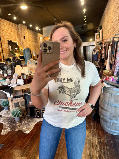 A Broker Leather Employee modeling our Brittany Chickens & Government Graphic Tee.