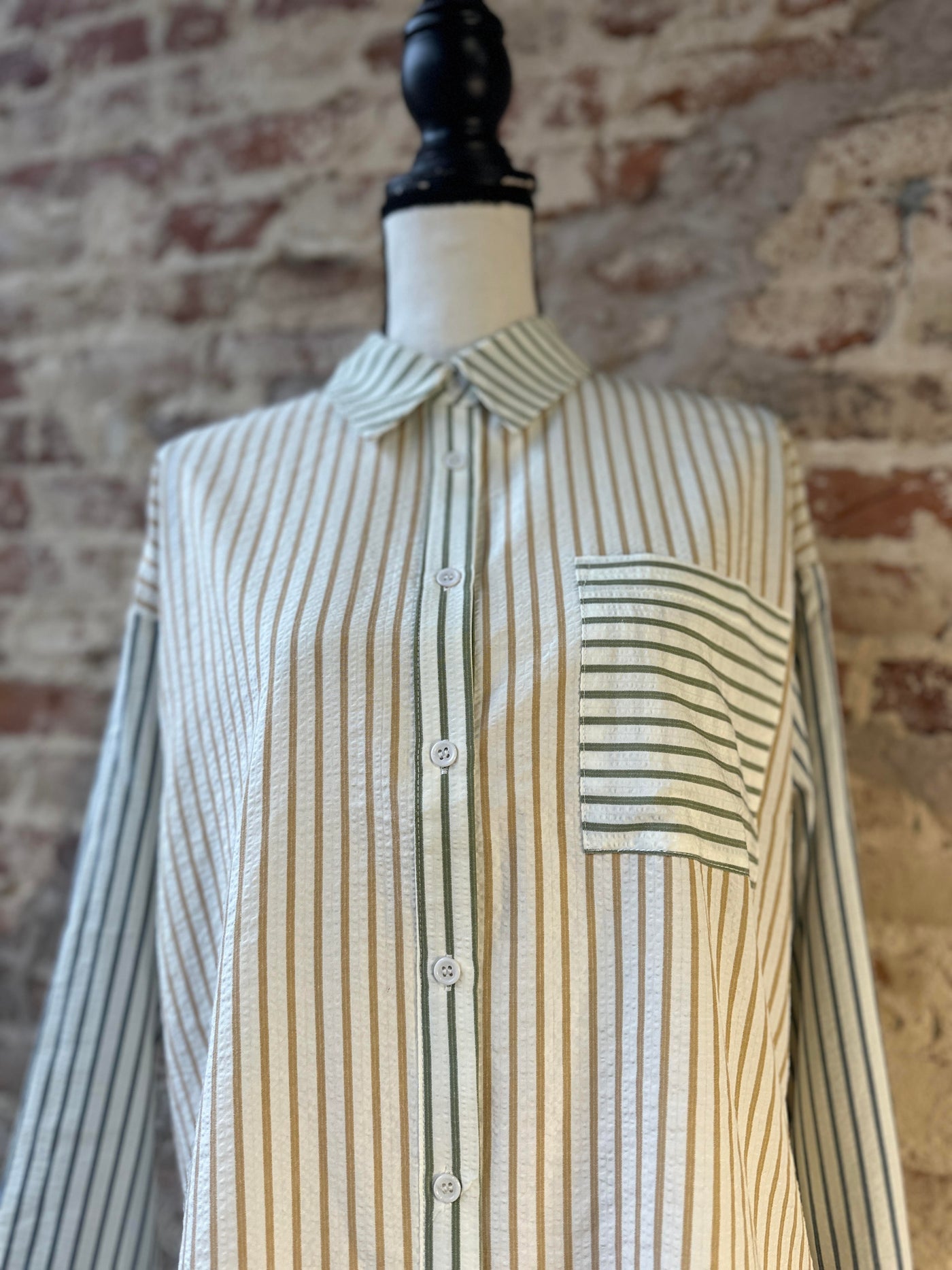 Close-up of Bryan Stripe Button Down Shirt showing vibrant stripes and one side bust pocket detail.