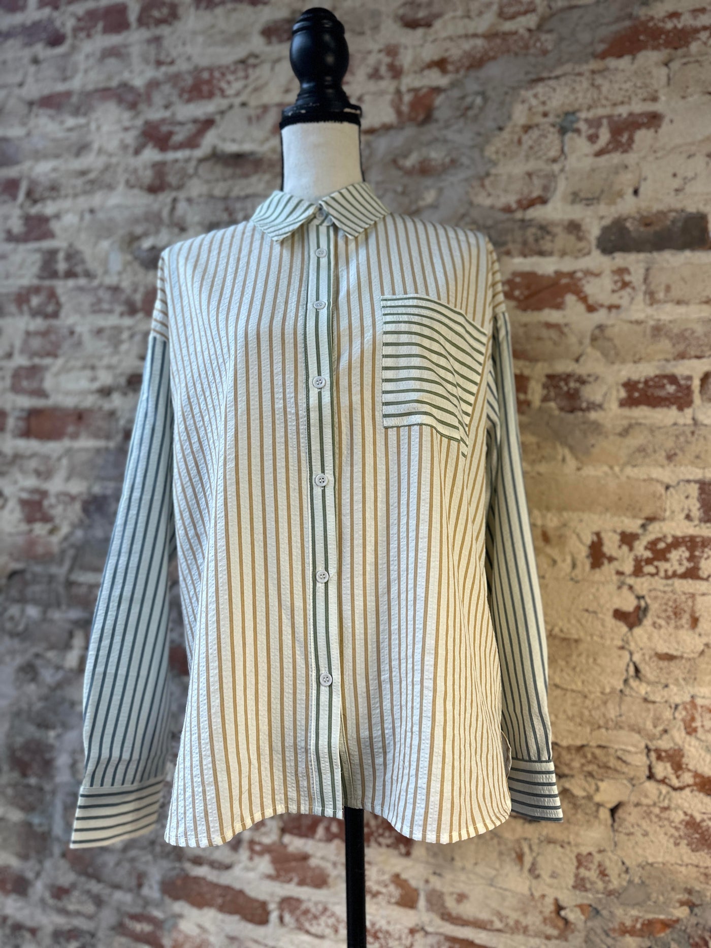 The front side of our Bryan Stripe Button Down Blouse Shirt on a mannequin.