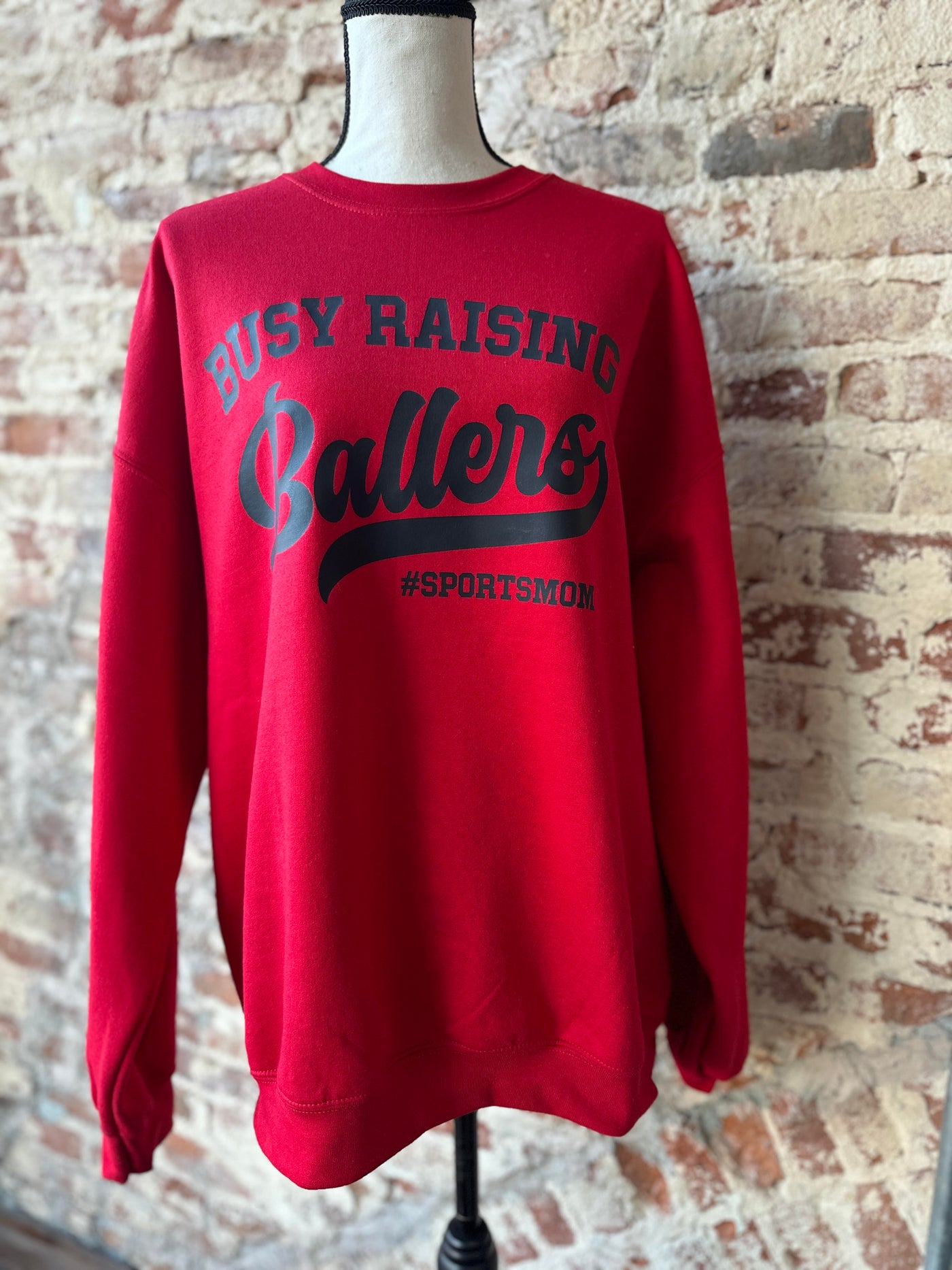 Red Busy Raising Ballers Crewneck Sweatshirt