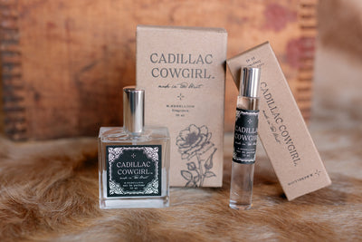 Fine fragrance roll-on perfume oil, paraben-free with a rustic Western bottle and packaging design.