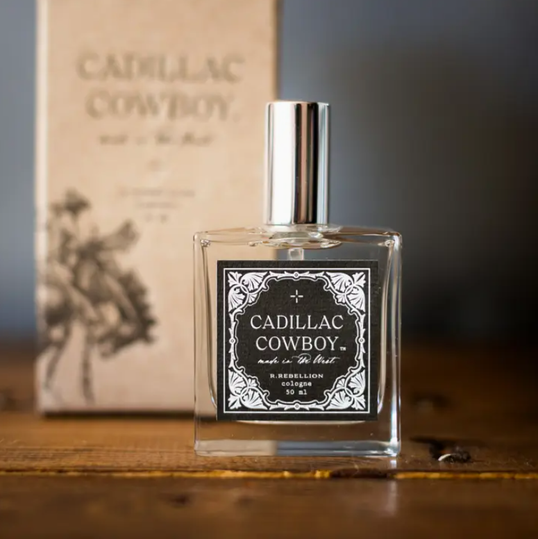 Rugged and timeless Cadillac Cowboy Cologne Spray, blending citrus, musk, and sandalwood in a 50 ml spray bottle, ideal for gifting or personal use.