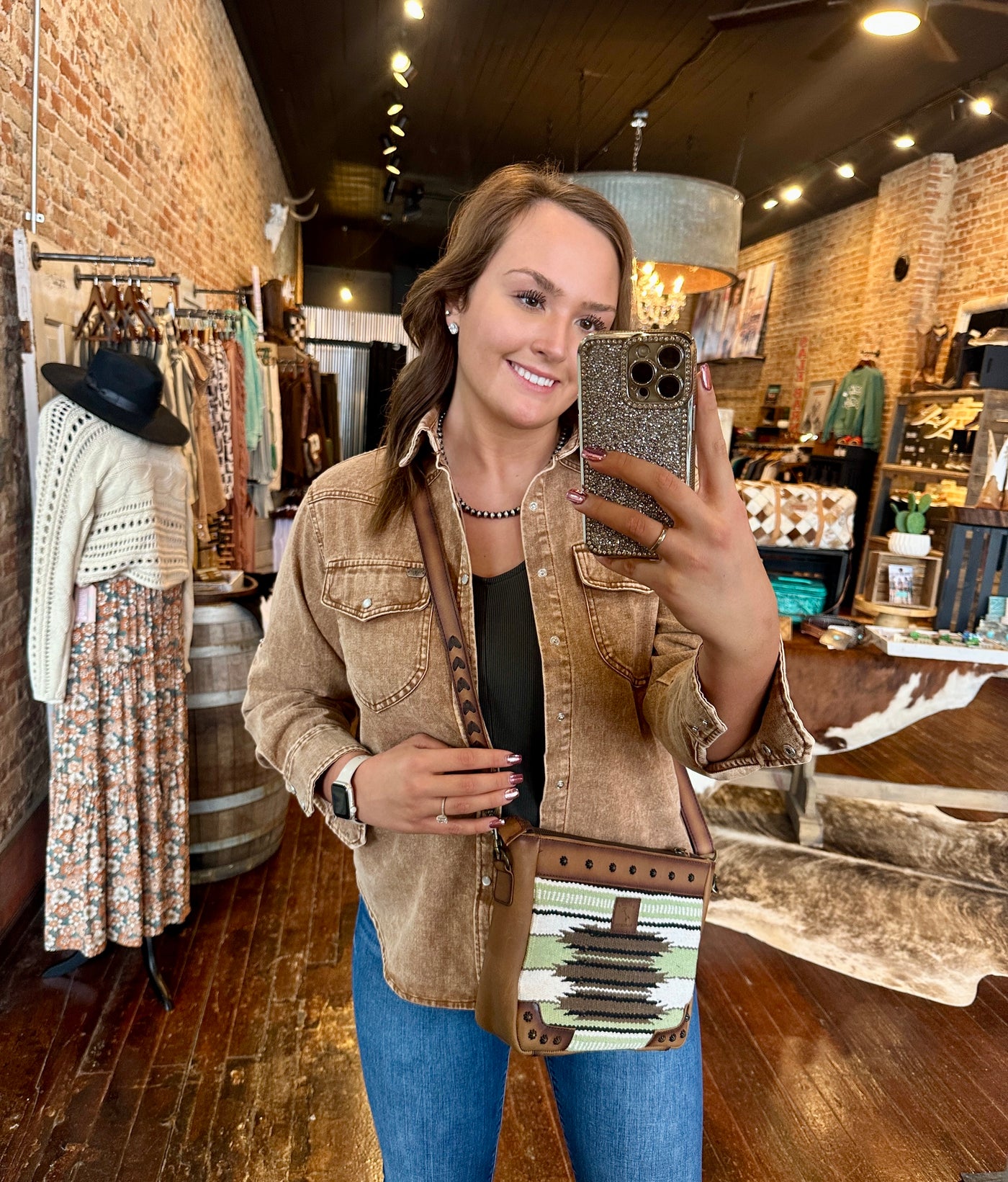 Broker Leather's Calum Saddle Blanket Crossbody Bag modeled by employee, Gracelyn, to show size relevance.