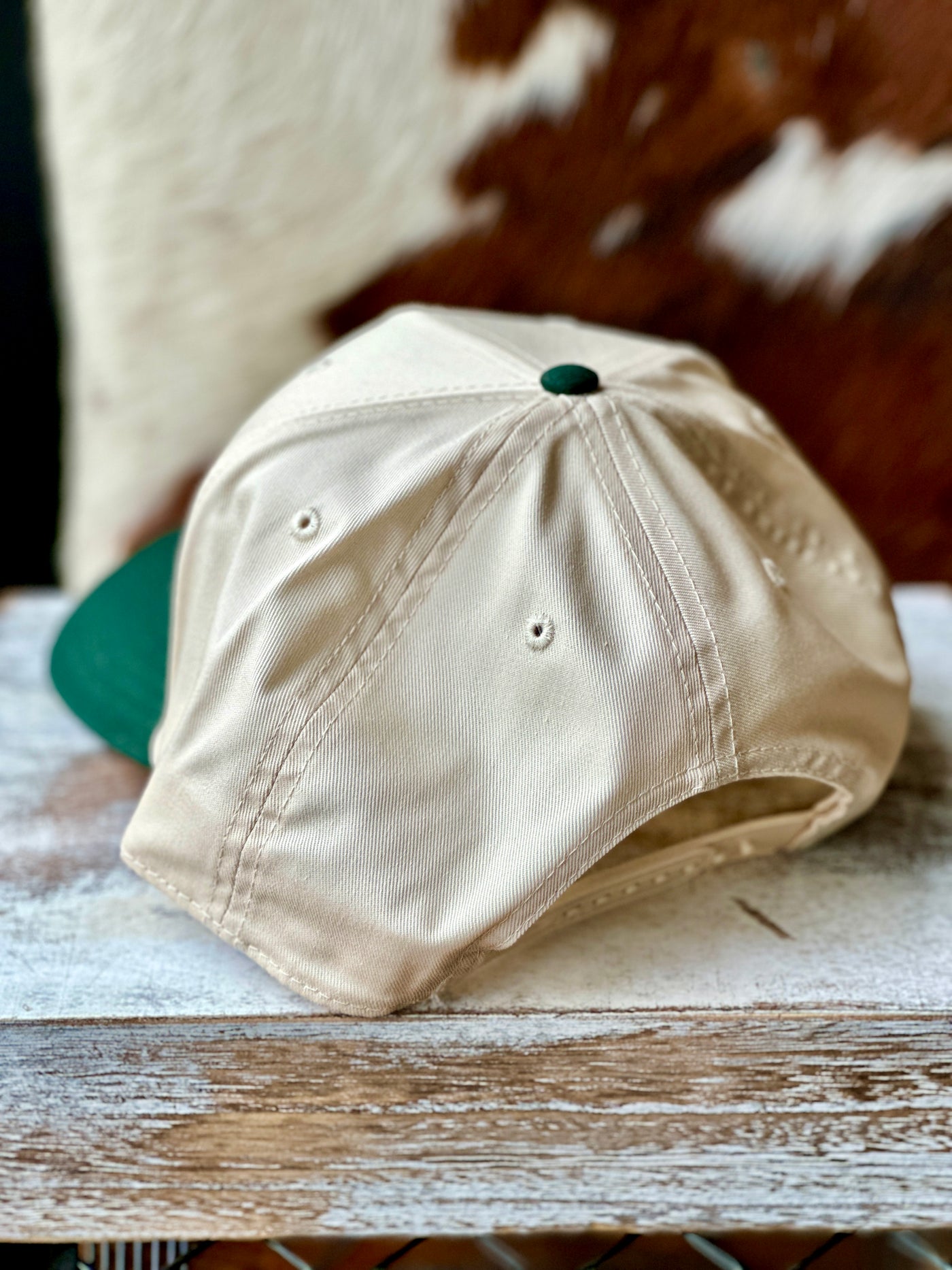 Back view of the Cassandra Small Town Smoke Show Baseball Cap, displaying the adjustable plastic snap closure for a custom fit.