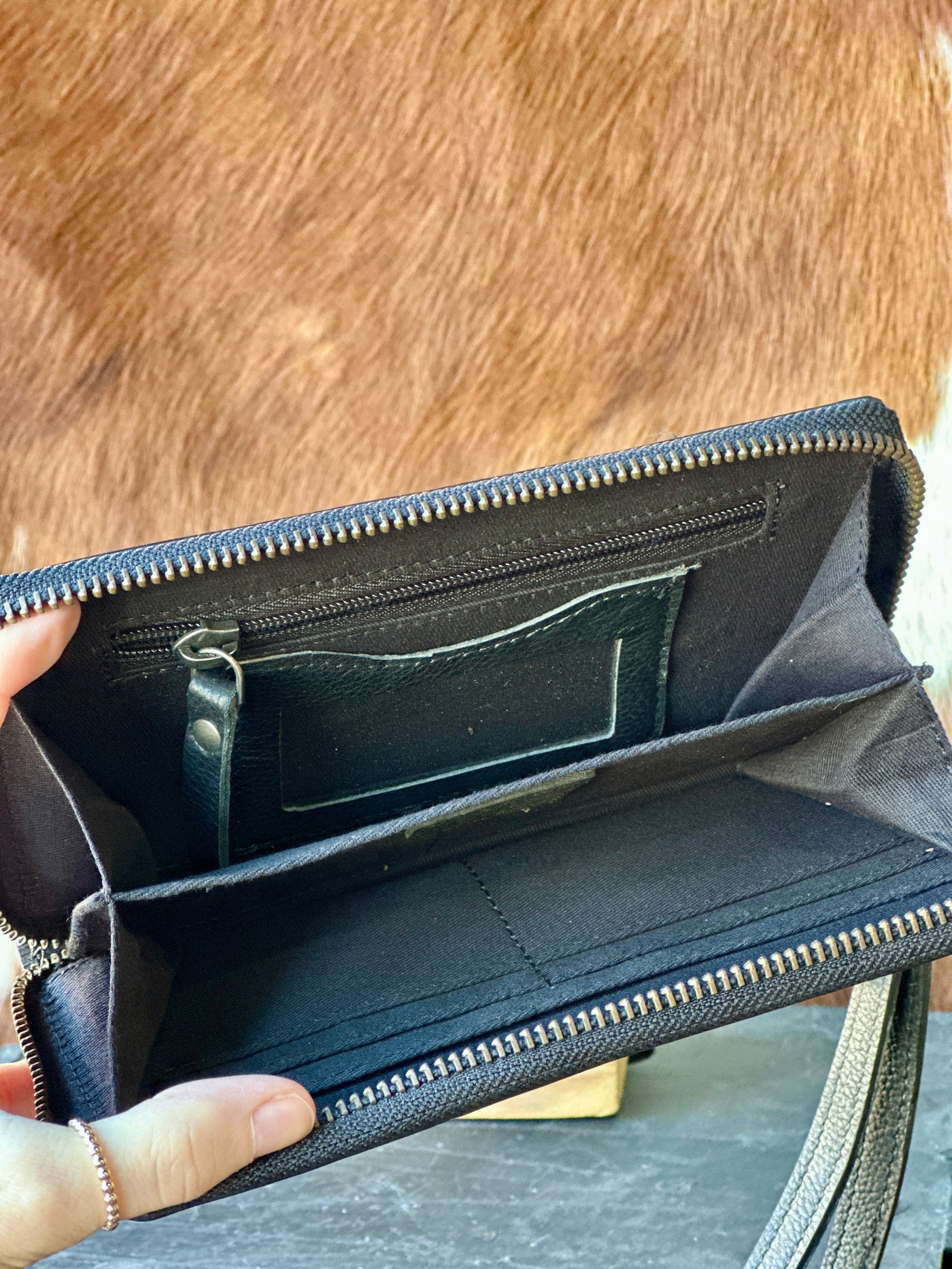 Interior view of the Cholula Wallet, showing five card slots, three long cash slots, and a zippered coin pocket.