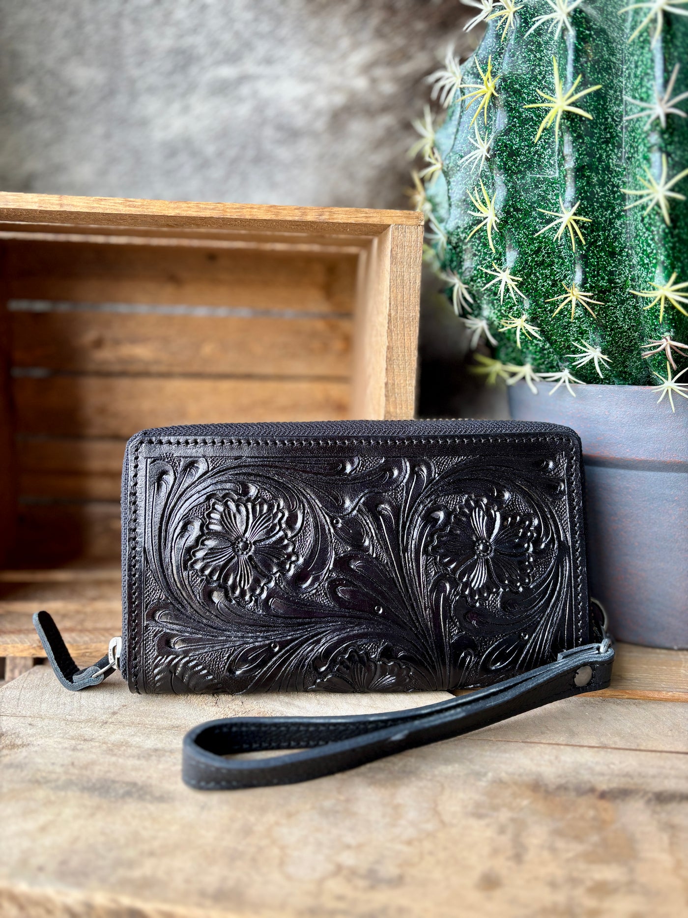 Front view of the Cholula Tooled Leather Wallet, featuring intricate floral tooling on genuine leather.