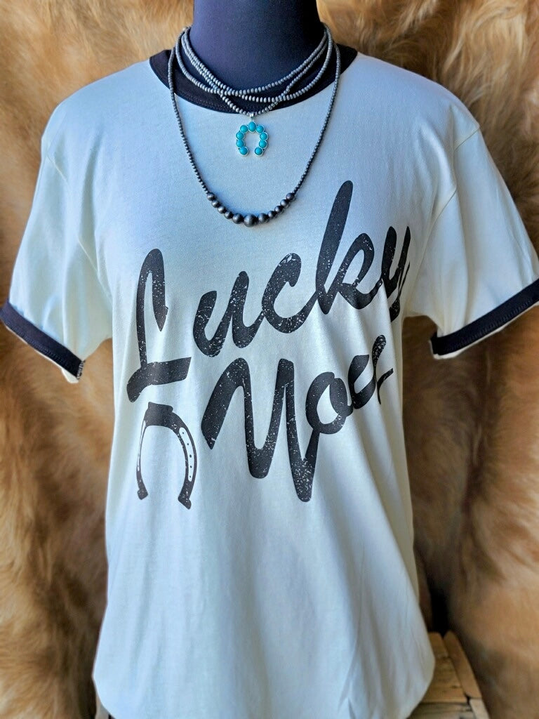 Cowgirl-inspired Cline Lucky You Tee with distressed lettering and lucky horseshoe design.