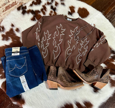 Brown sweatshirt reminiscent of dusty backroads and western adventures.