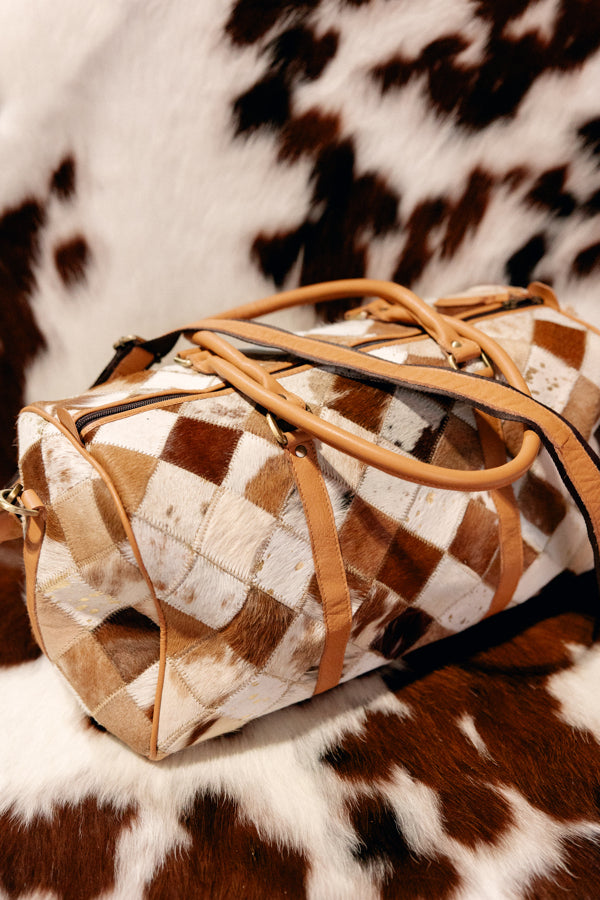 Side profile of the Cody Checkered Duffel Bag, perfect for weekend getaways or rodeo trips.