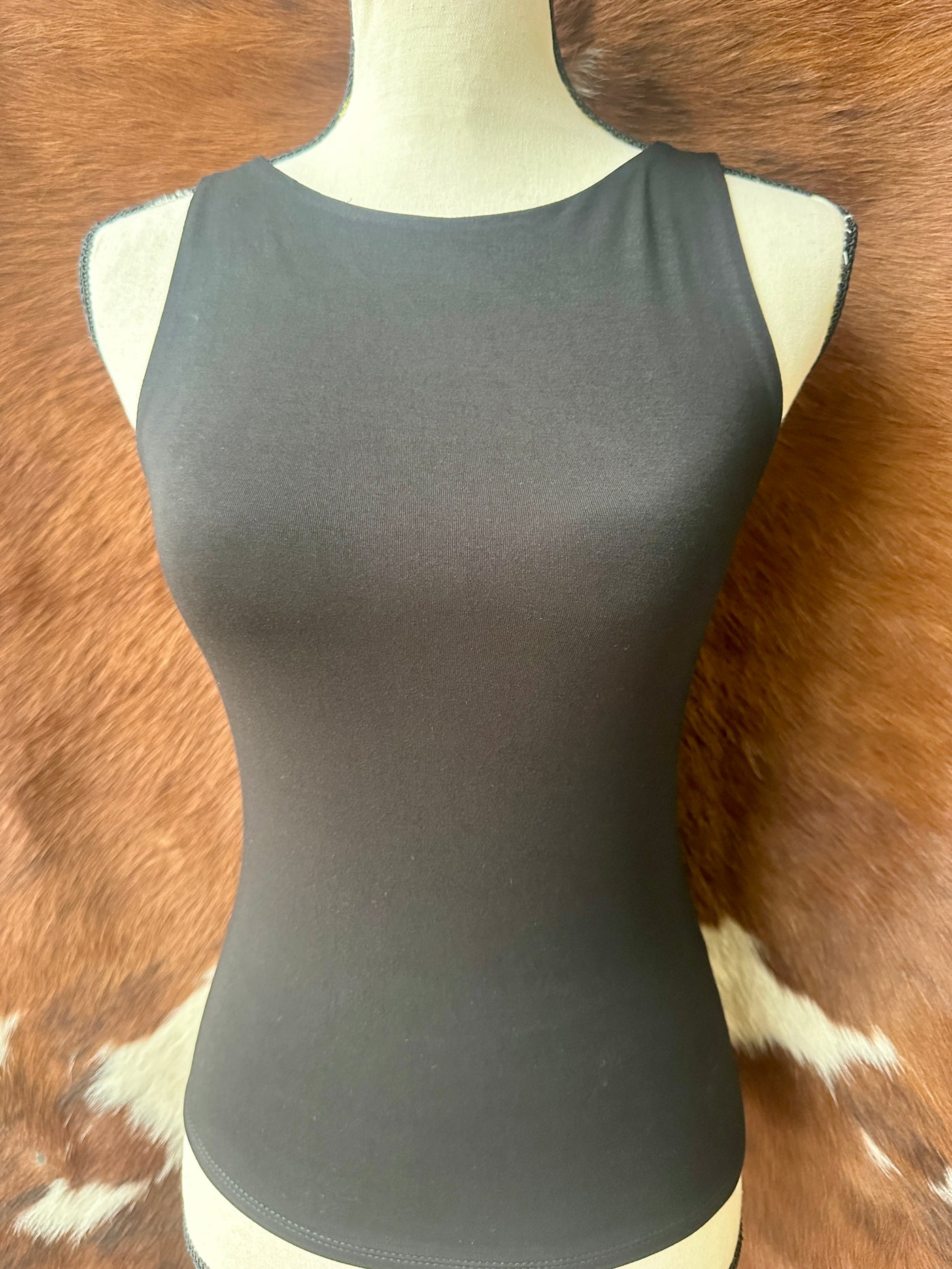 Ultra-soft black boat neck tank with a figure-flattering silhouette.