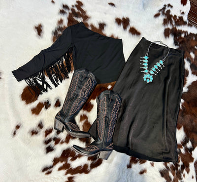 Western-inspired one-shoulder top with flirty fringe detailing, perfect for making a statement at any event.