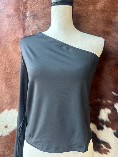 Lightweight, flowy fabric one-shoulder fringe top for cowgirl glam at honky-tonks or under neon lights.