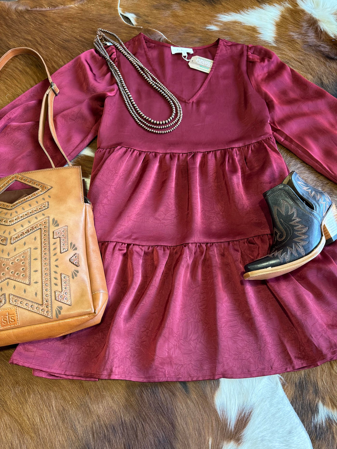 Cyrus Tiered Ruffle Dress in burgundy with a flattering V-neckline.