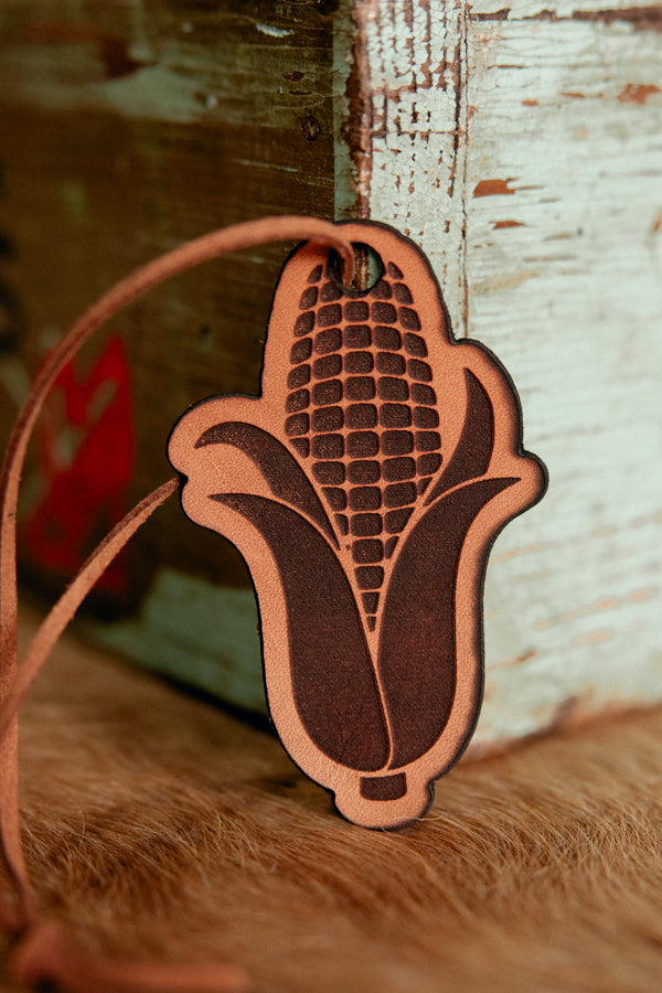 Close-up of DeKalb Refillable Leather Car Air Freshener, unscented, with leather texture.