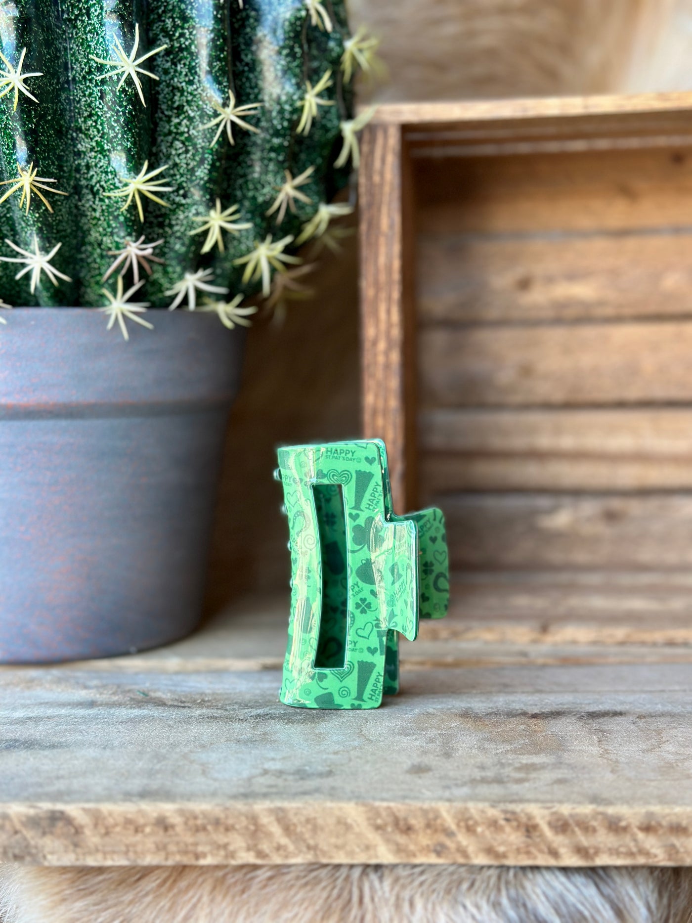 Festive Declan St. Patty's Day Print Claw Clip adorned with shamrocks, ideal for adding a touch of holiday spirit to your hairstyle.