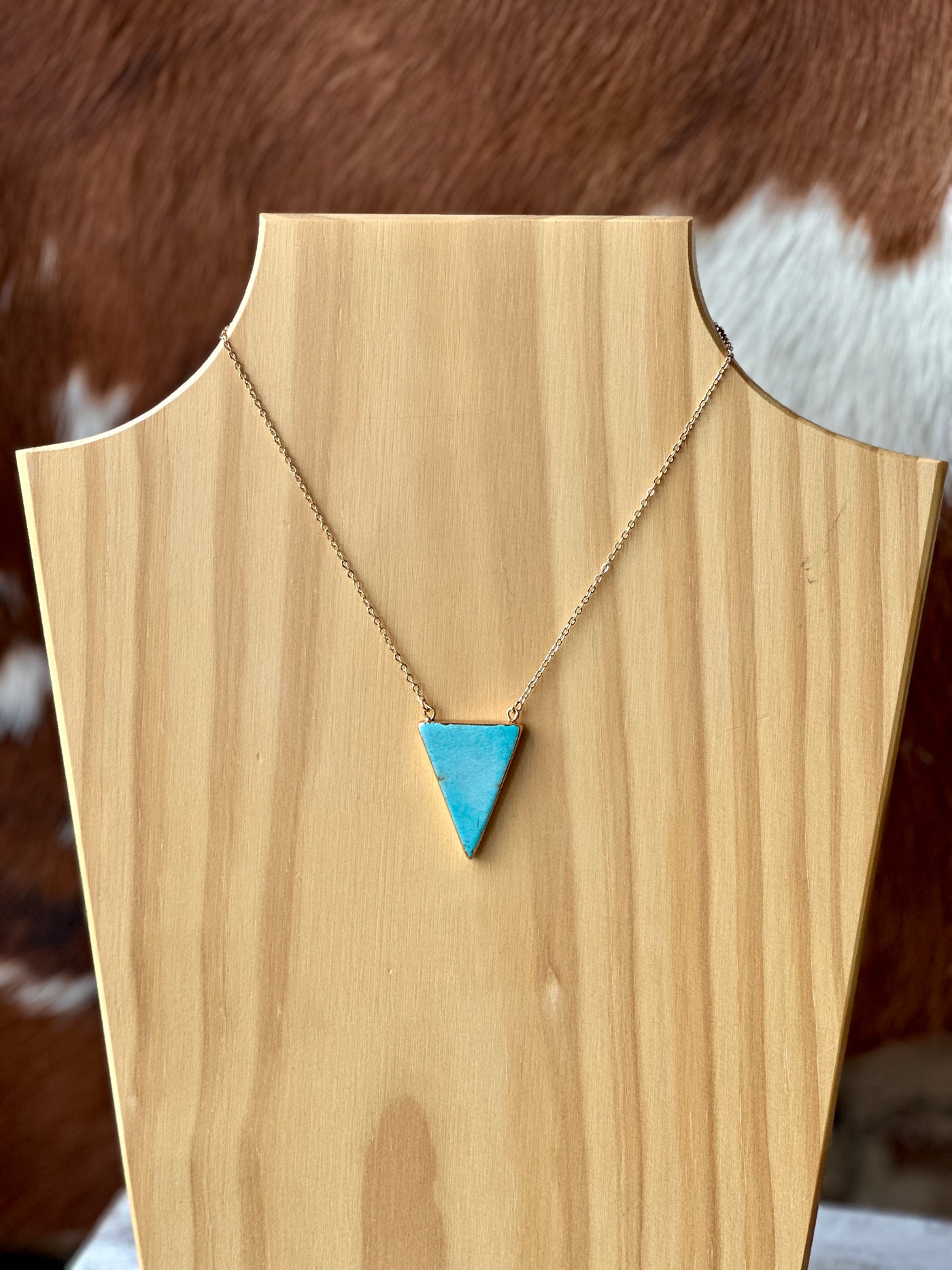 Dolly Triangle Turquoise Necklace with faux turquoise pendant on an 18” chain.